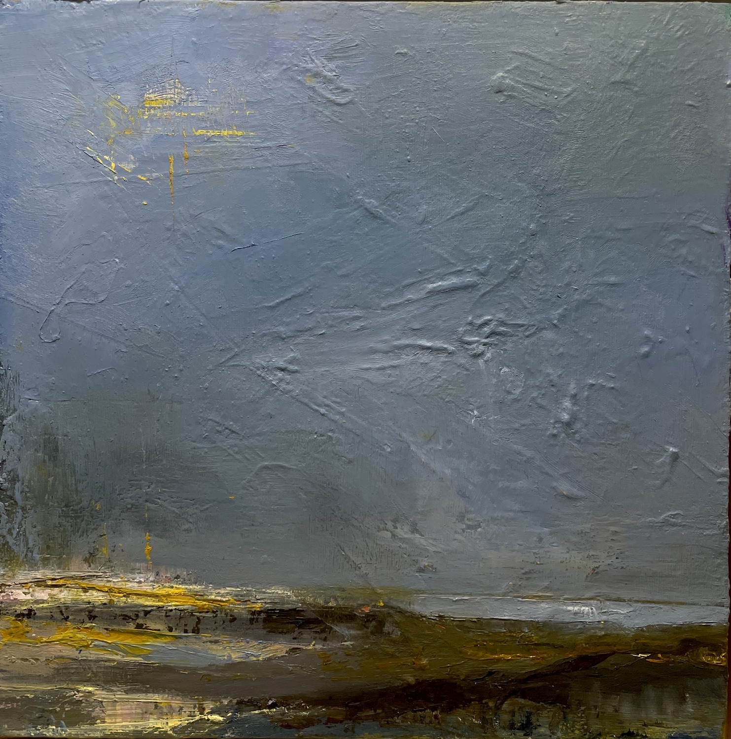 A grey weather-sky coming down over a low dark band of land, one break of gold at the horizon